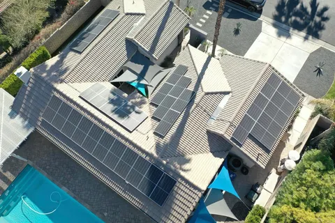 a lobby with furniture and potted plants
