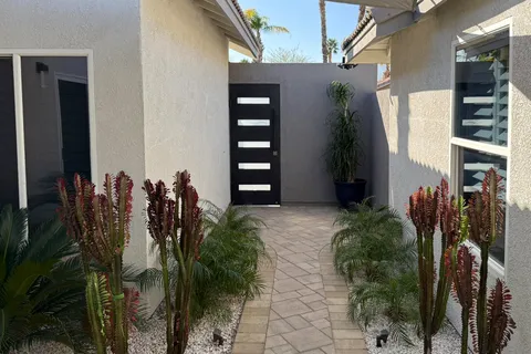a patio with a table and chairs