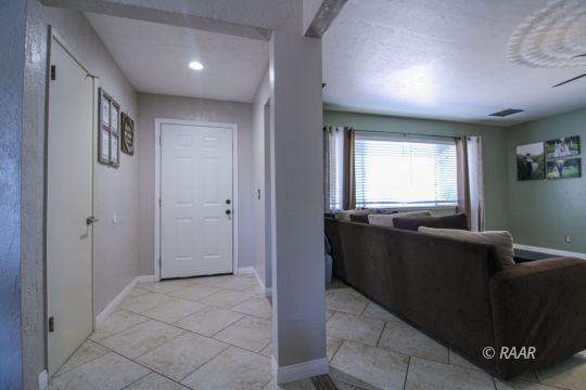 221 South Primrose Street Ridgecrest, CA 93555 - Photo 4 of 29 a living room with furniture and a window