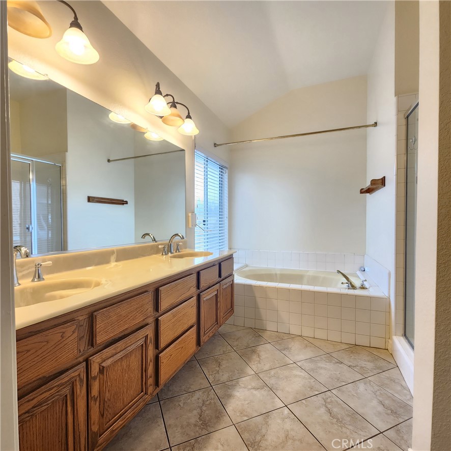 21029 Northview Drive Walnut, CA 91789 - Photo 17 of 22 a spacious bathroom with a bathtub sink and mirror