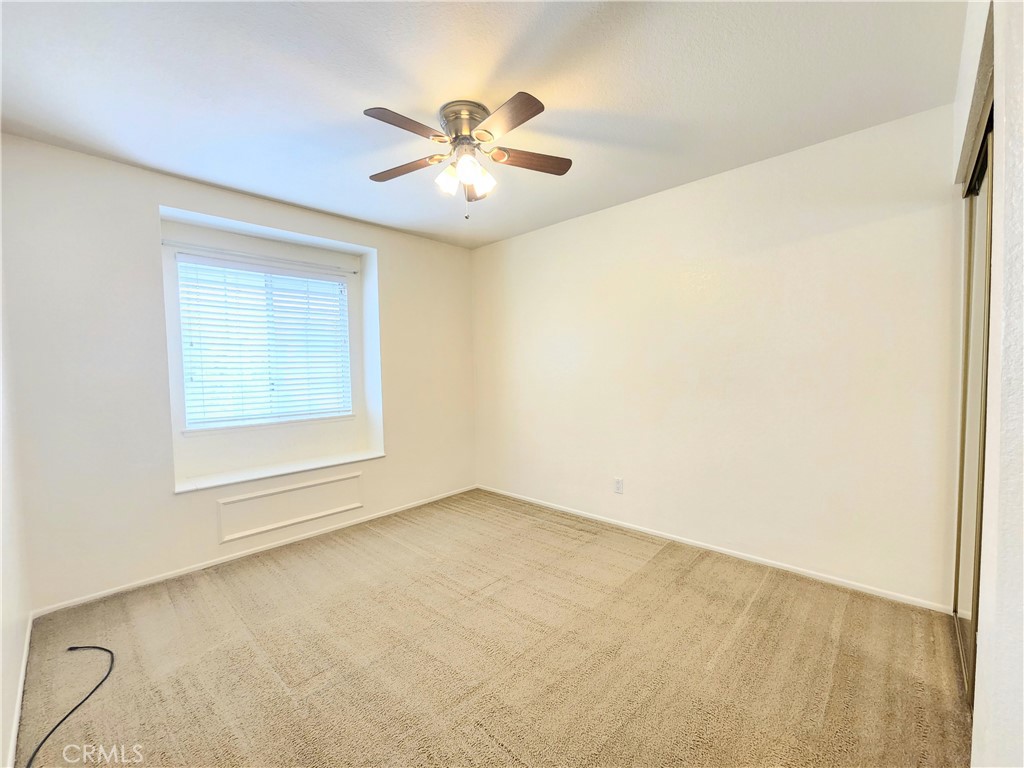 21029 Northview Drive Walnut, CA 91789 - Photo 20 of 22 an empty room with windows and fan