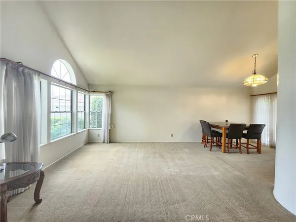 a view of dining room with furniture and chandelier