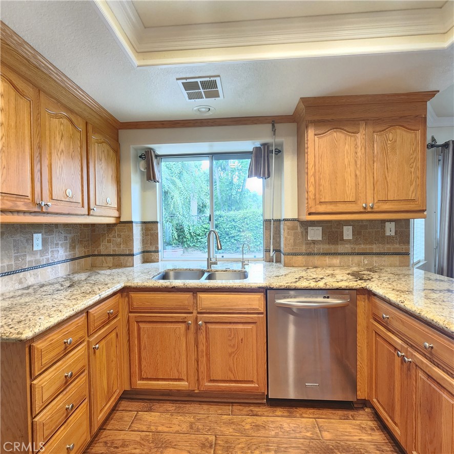 21029 Northview Drive Walnut, CA 91789 - Photo 7 of 22 a kitchen with a sink stove and cabinets