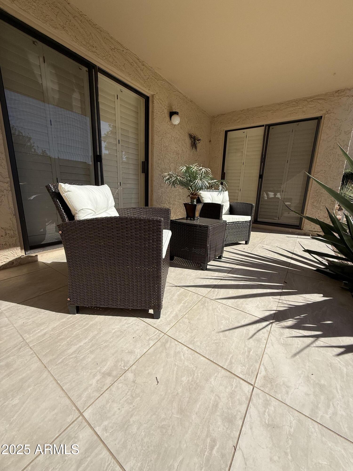 8649 East Royal Palm Road, Unit 104 Scottsdale, AZ 85258 - Photo 16 of 20 a living room with furniture