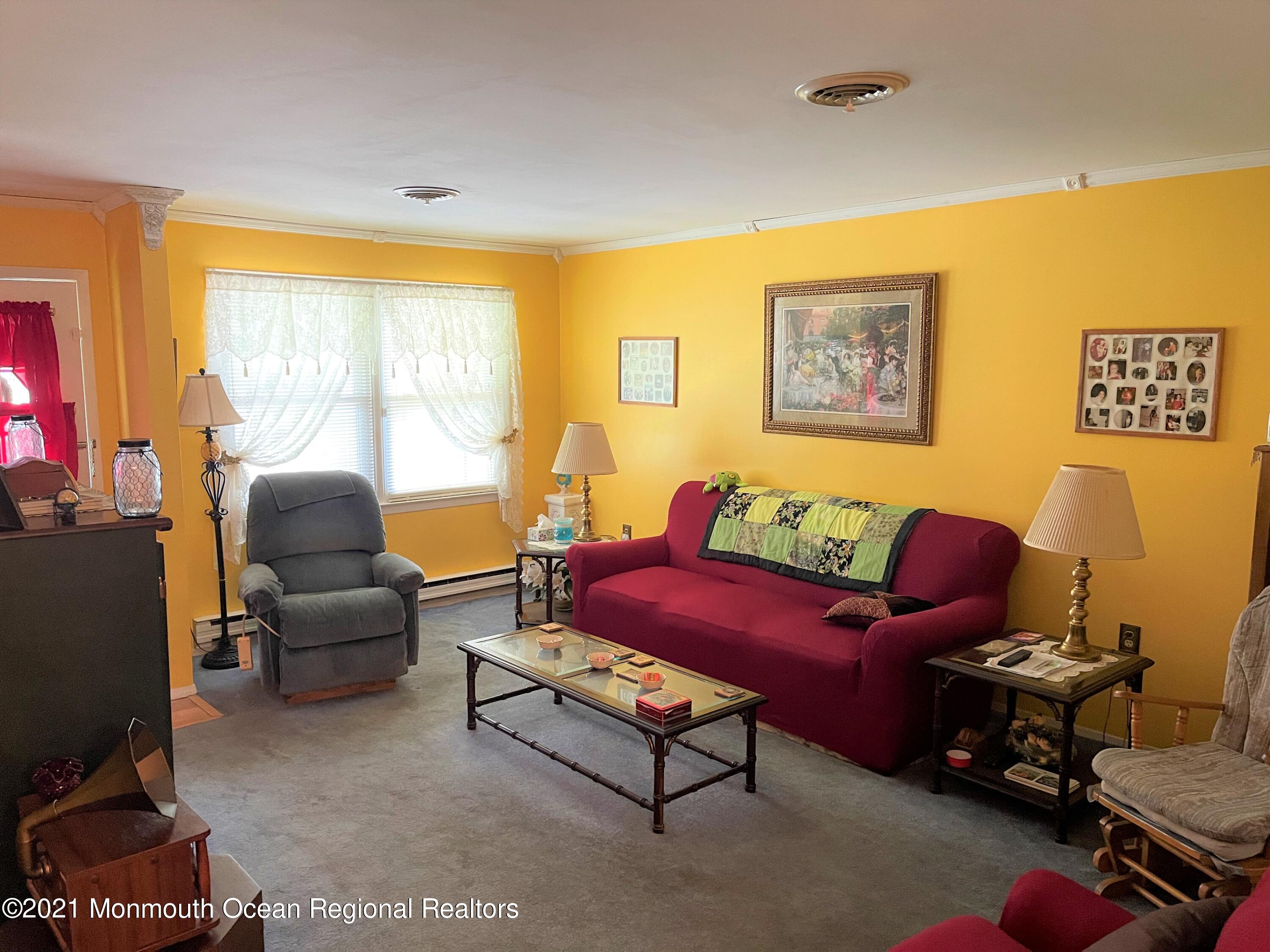 19 Augusta Road, Unit 73 Whiting, NJ 08759 - Photo 3 of 11 a living room with furniture and a large window