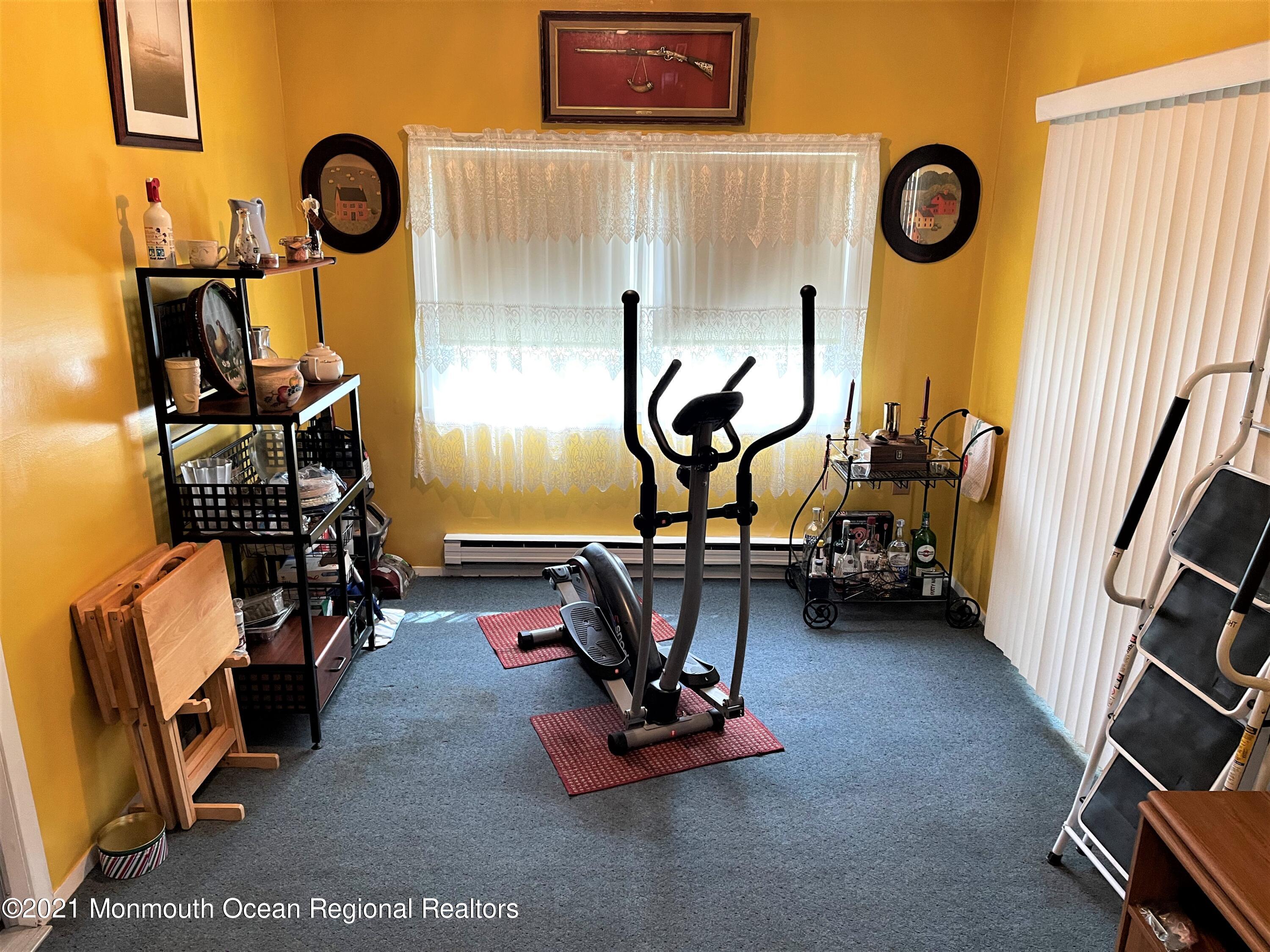 19 Augusta Road, Unit 73 Whiting, NJ 08759 - Photo 5 of 11 a view of a room with gym equipment