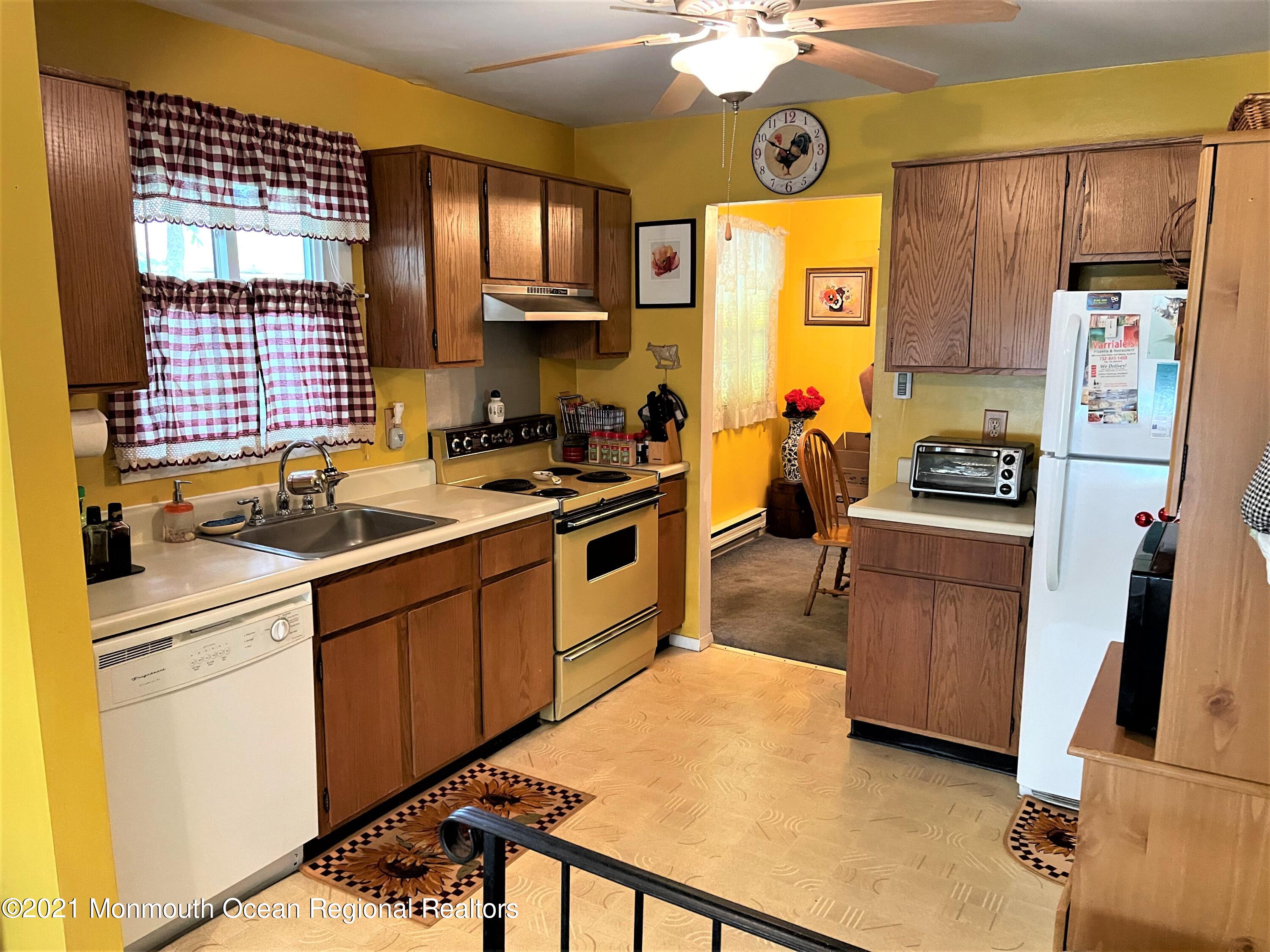 19 Augusta Road, Unit 73 Whiting, NJ 08759 - Photo 6 of 11 a kitchen with stainless steel appliances a refrigerator sink and cabinets