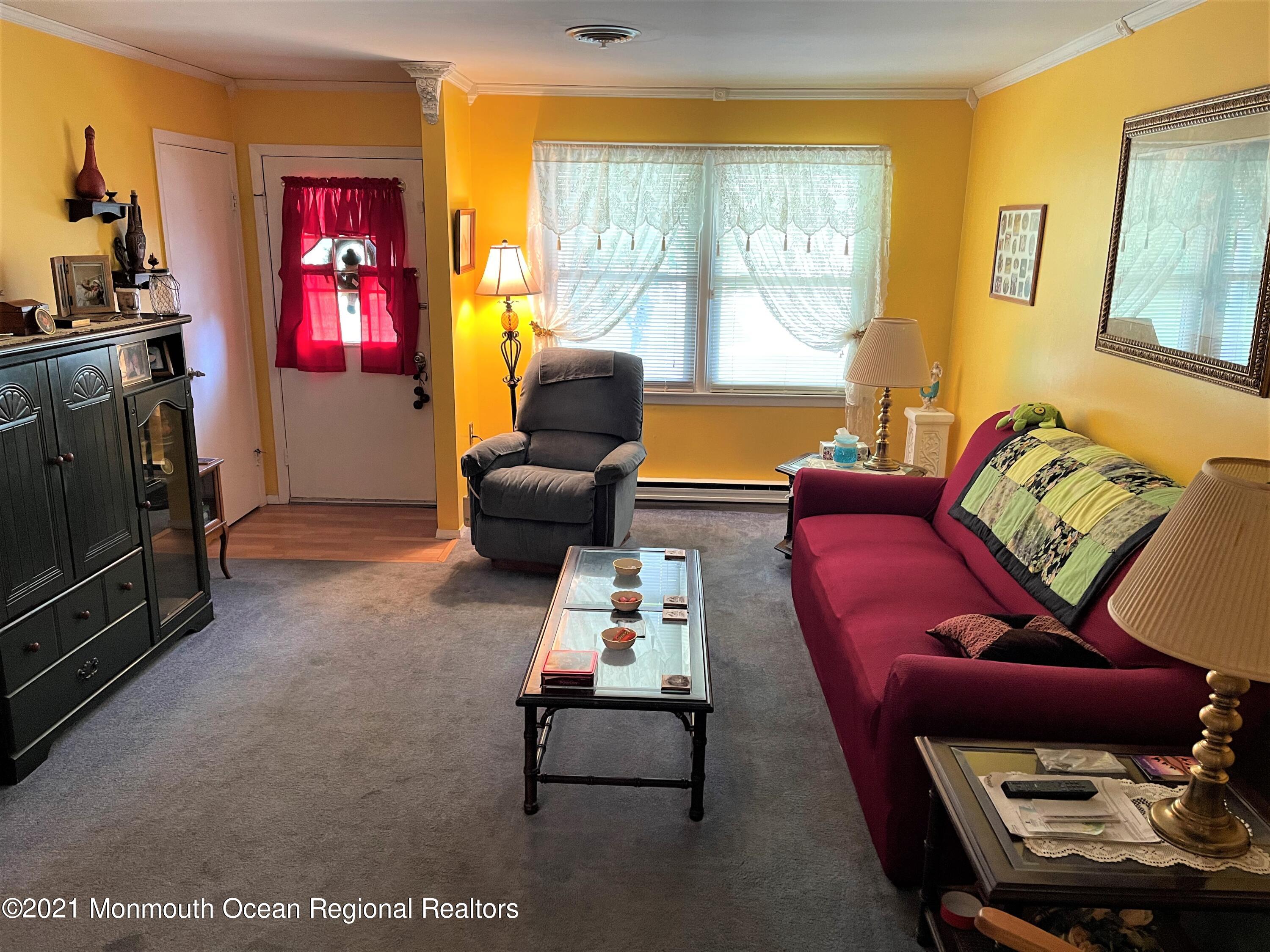 19 Augusta Road, Unit 73 Whiting, NJ 08759 - Photo 7 of 11 a living room with furniture fireplace and a flat screen tv