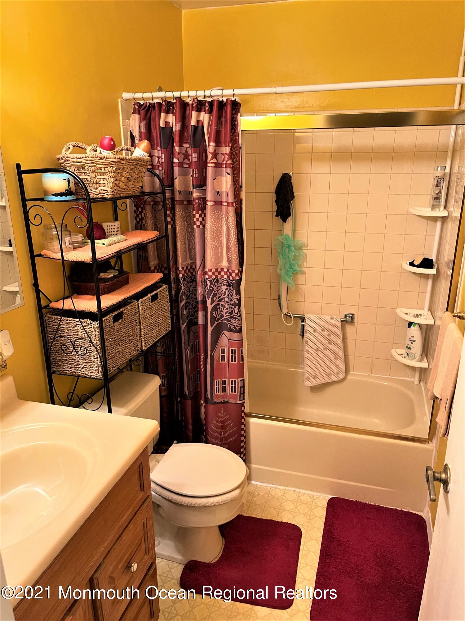 19 Augusta Road, Unit 73 Whiting, NJ 08759 - Photo 9 of 11 a bathroom with a toilet and shower