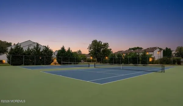 a view of an outdoor space and tennis court