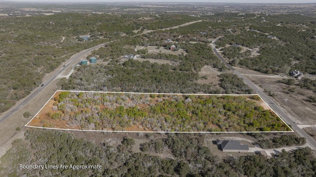2280 Compass Way Bluff Dale, TX 76433 - Photo 16 of 40 an aerial view of residential houses with outdoor space