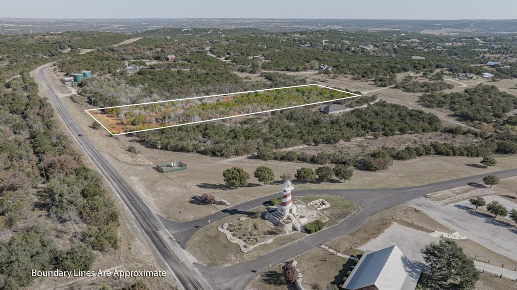 2280 Compass Way Bluff Dale, TX 76433 - Photo 17 of 40 an aerial view of a house with a yard