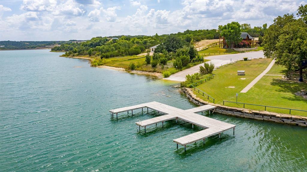 2280 Compass Way Bluff Dale, TX 76433 - Photo 21 of 40 an aerial view of a house with a garden and lake view