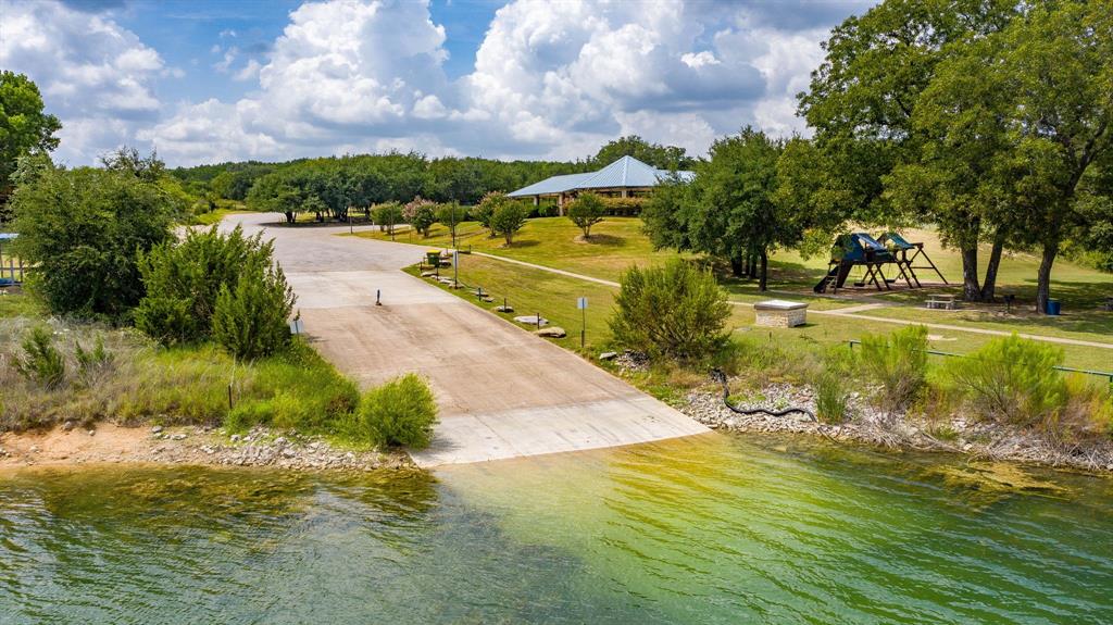 2280 Compass Way Bluff Dale, TX 76433 - Photo 23 of 40 a view of a lake with a yard