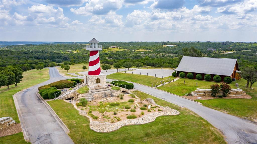 2280 Compass Way Bluff Dale, TX 76433 - Photo 28 of 40 an aerial view of a house with swimming pool and green space