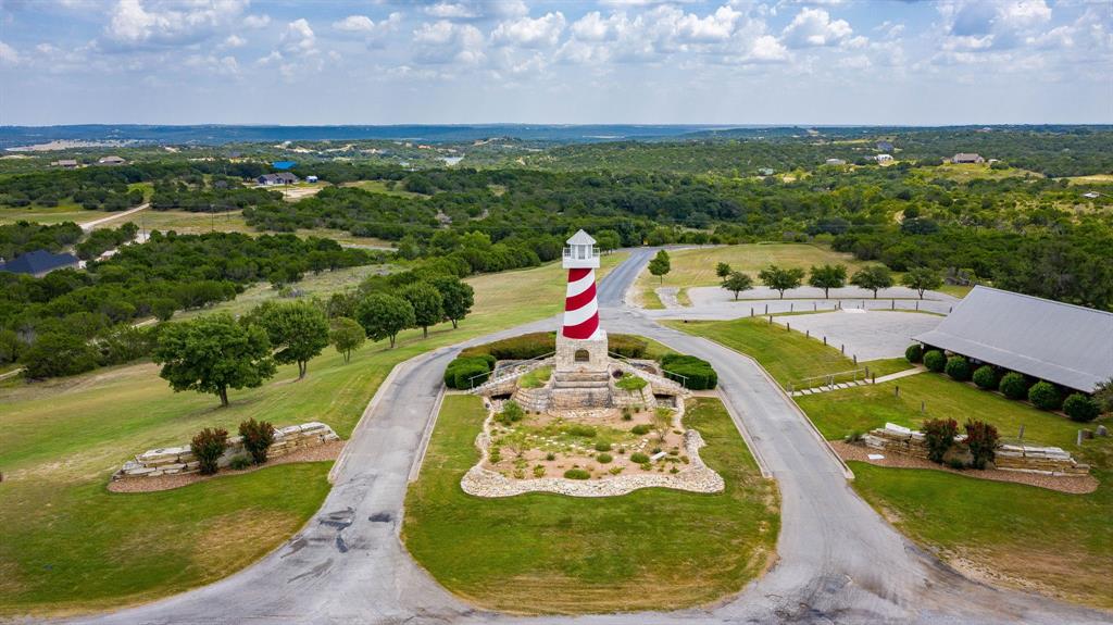 2280 Compass Way Bluff Dale, TX 76433 - Photo 29 of 40 a view of a swimming pool with a yard and seating area