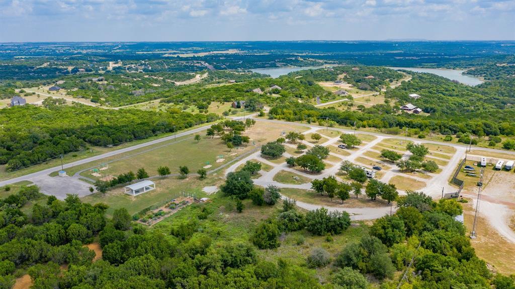 2280 Compass Way Bluff Dale, TX 76433 - Photo 34 of 40 an aerial view of residential houses with outdoor space and trees
