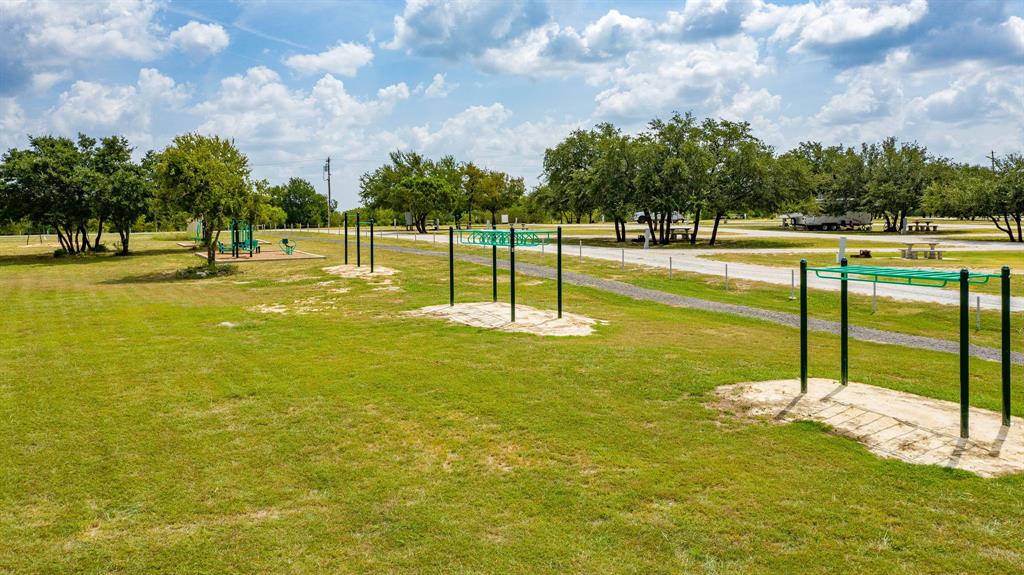 2280 Compass Way Bluff Dale, TX 76433 - Photo 36 of 40 a view of a swimming pool with an outdoor space and seating area