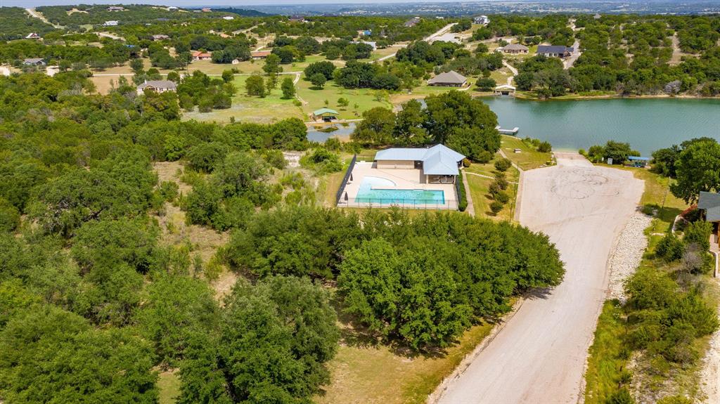 2280 Compass Way Bluff Dale, TX 76433 - Photo 38 of 40 an aerial view of a house with a yard and lake view