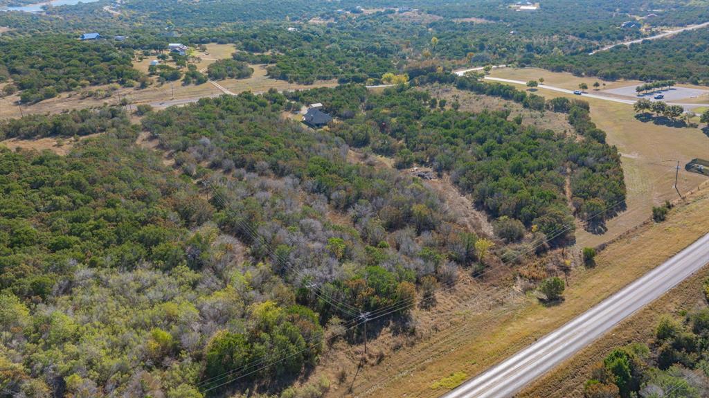 2280 Compass Way Bluff Dale, TX 76433 - Photo 4 of 40 an aerial view of residential houses with outdoor space and trees