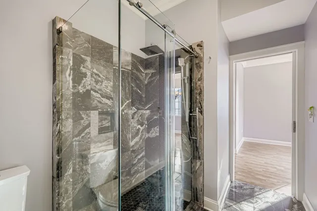a view of storage and utility room with washer and dryer