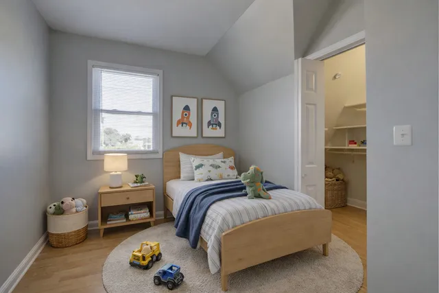 an empty room with windows and closet