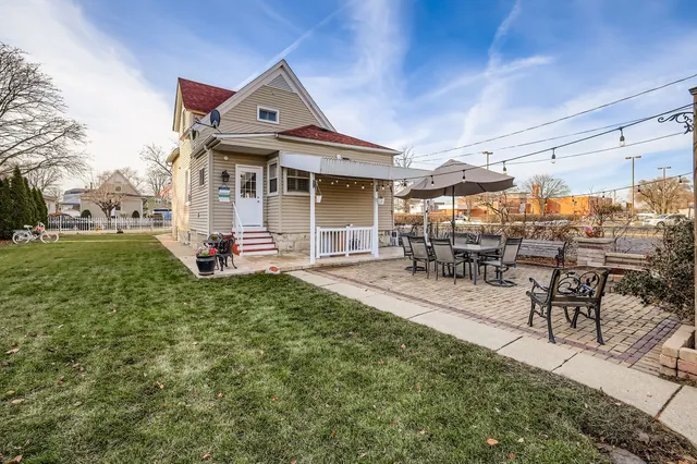 a view of a tables and chairs under an umbrella