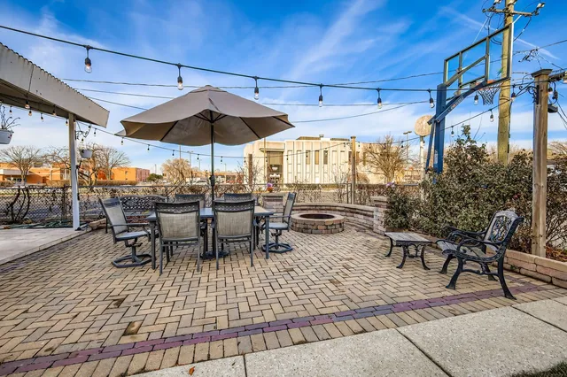 a view of a backyard with sitting area