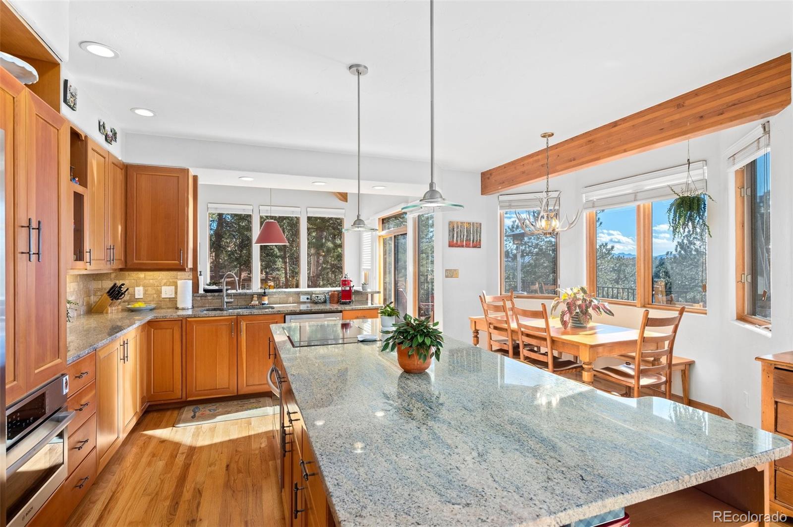 30754 Stratton Court Evergreen, CO 80439 - Photo 14 of 40 a kitchen with large windows