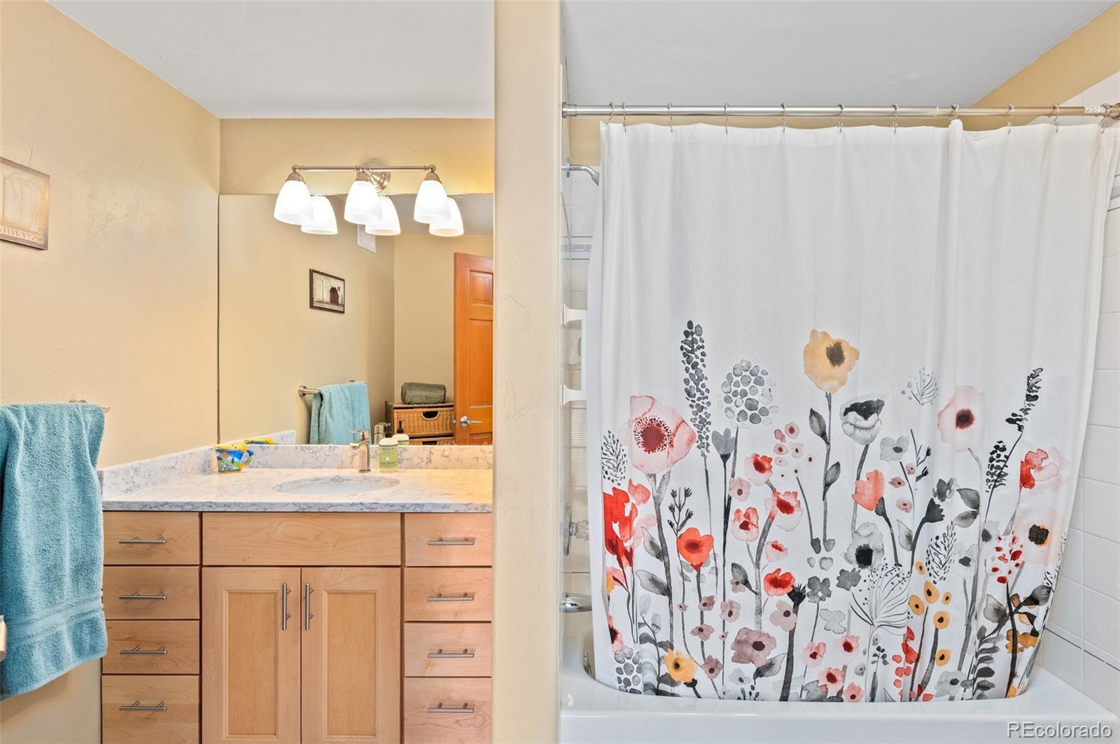 30754 Stratton Court Evergreen, CO 80439 - Photo 29 of 40 a bathroom with a sink and a mirror