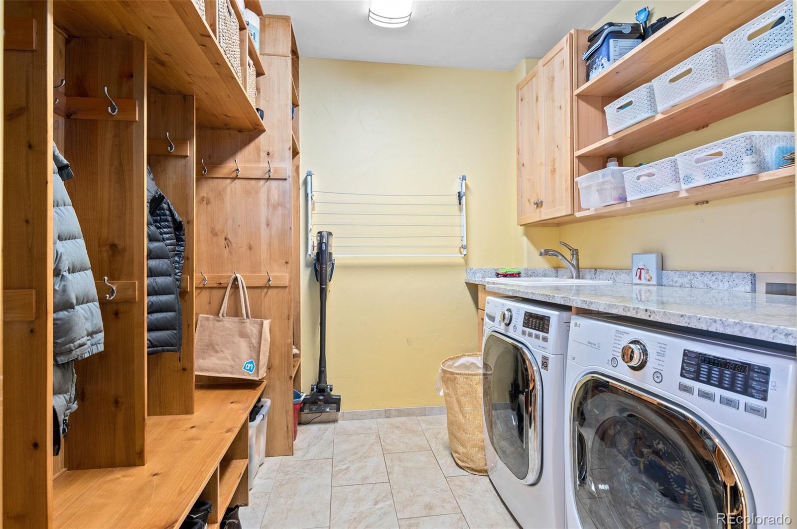 30754 Stratton Court Evergreen, CO 80439 - Photo 30 of 40 a utility room with dryer and washer