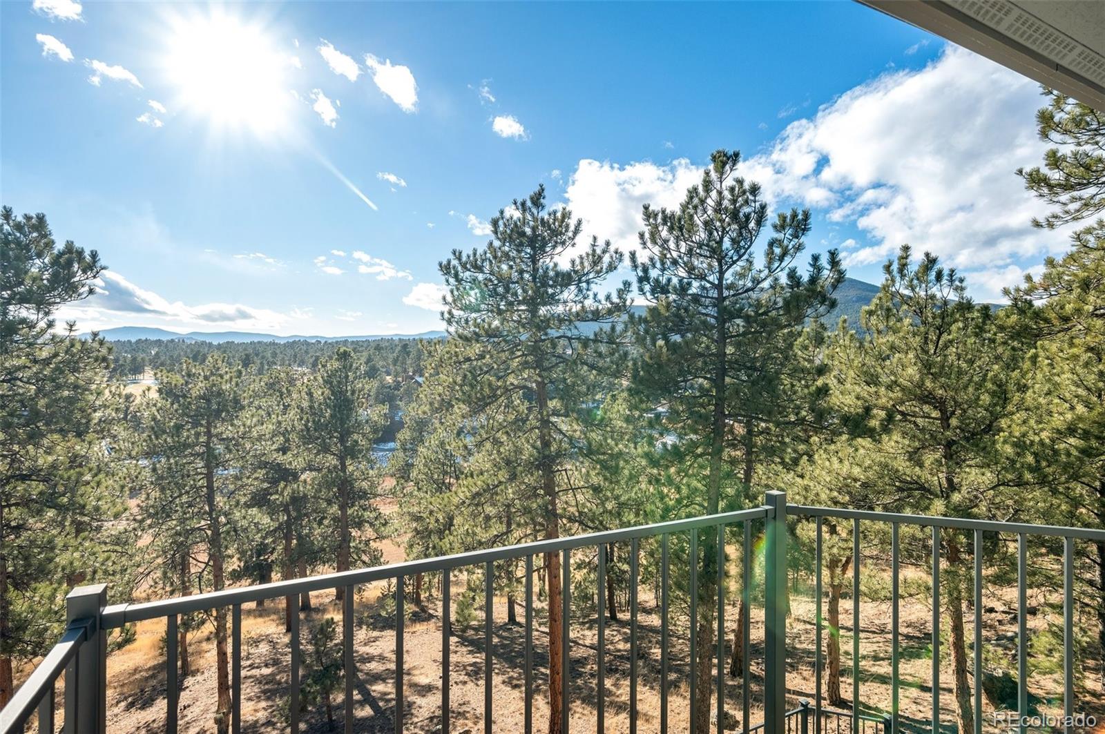 30754 Stratton Court Evergreen, CO 80439 - Photo 33 of 40 a view of a balcony with an outdoor space