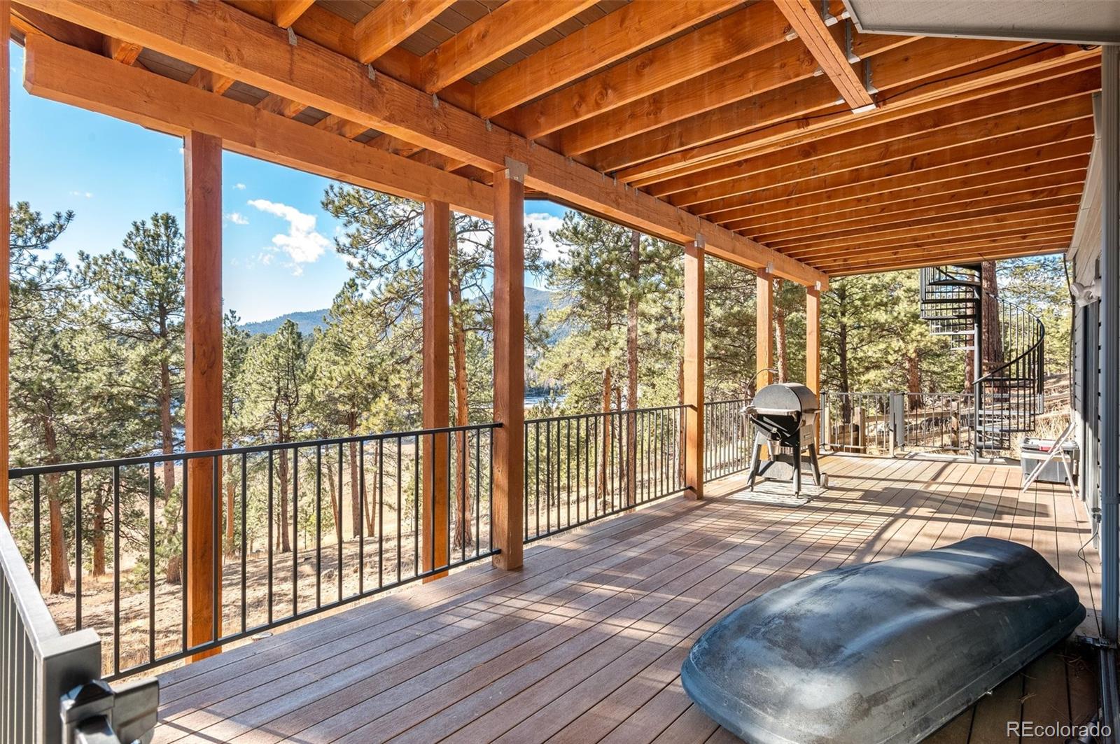 30754 Stratton Court Evergreen, CO 80439 - Photo 34 of 40 a balcony with wooden floor