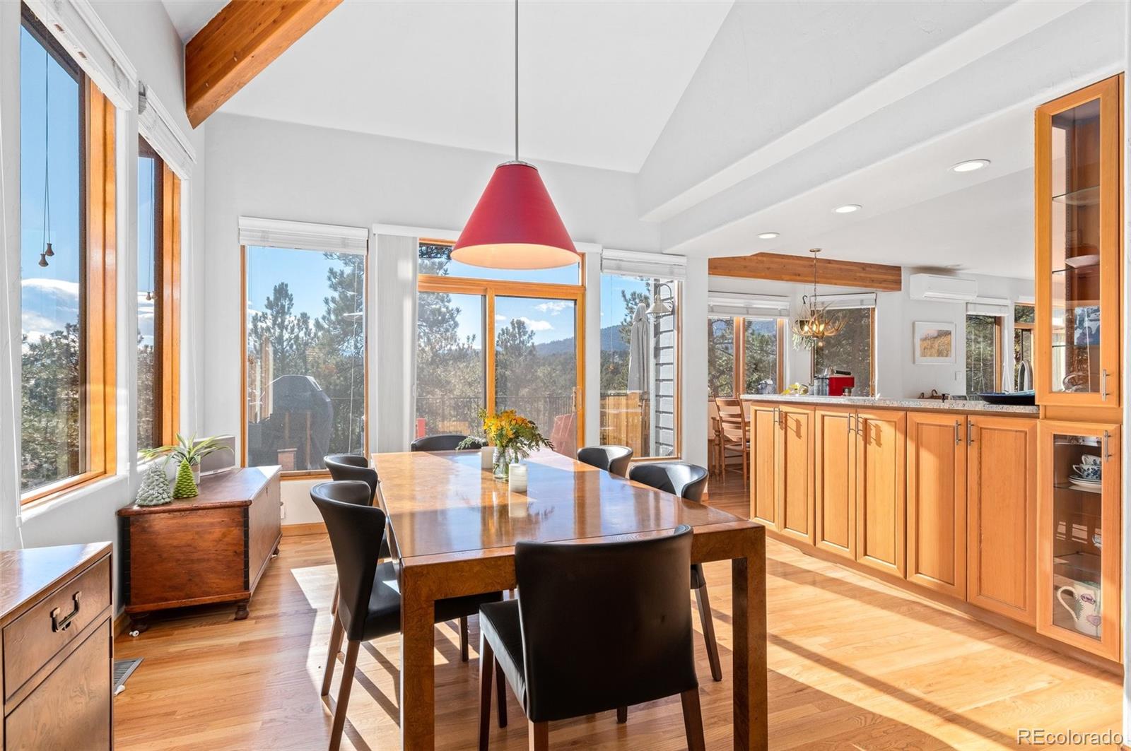 30754 Stratton Court Evergreen, CO 80439 - Photo 10 of 40 a view of a dining room with furniture window and outside view