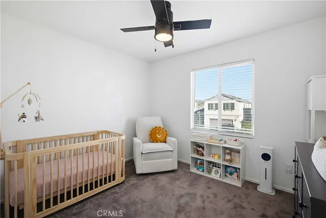 a bedroom with furniture and window