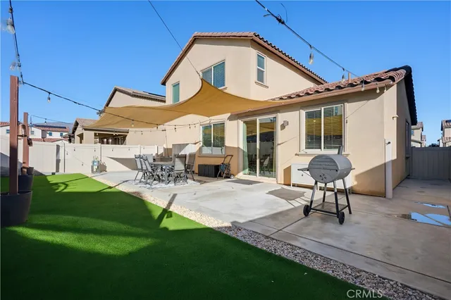 a patio with table and chairs