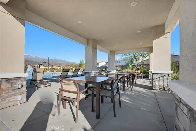 a view of a dining room with furniture window and outside view
