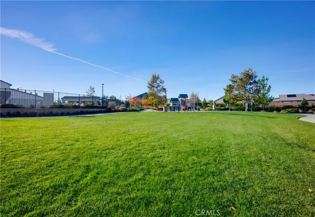 a view of a field of grass and building