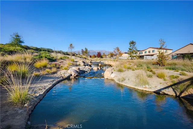 a view of a swimming pool with sitting area