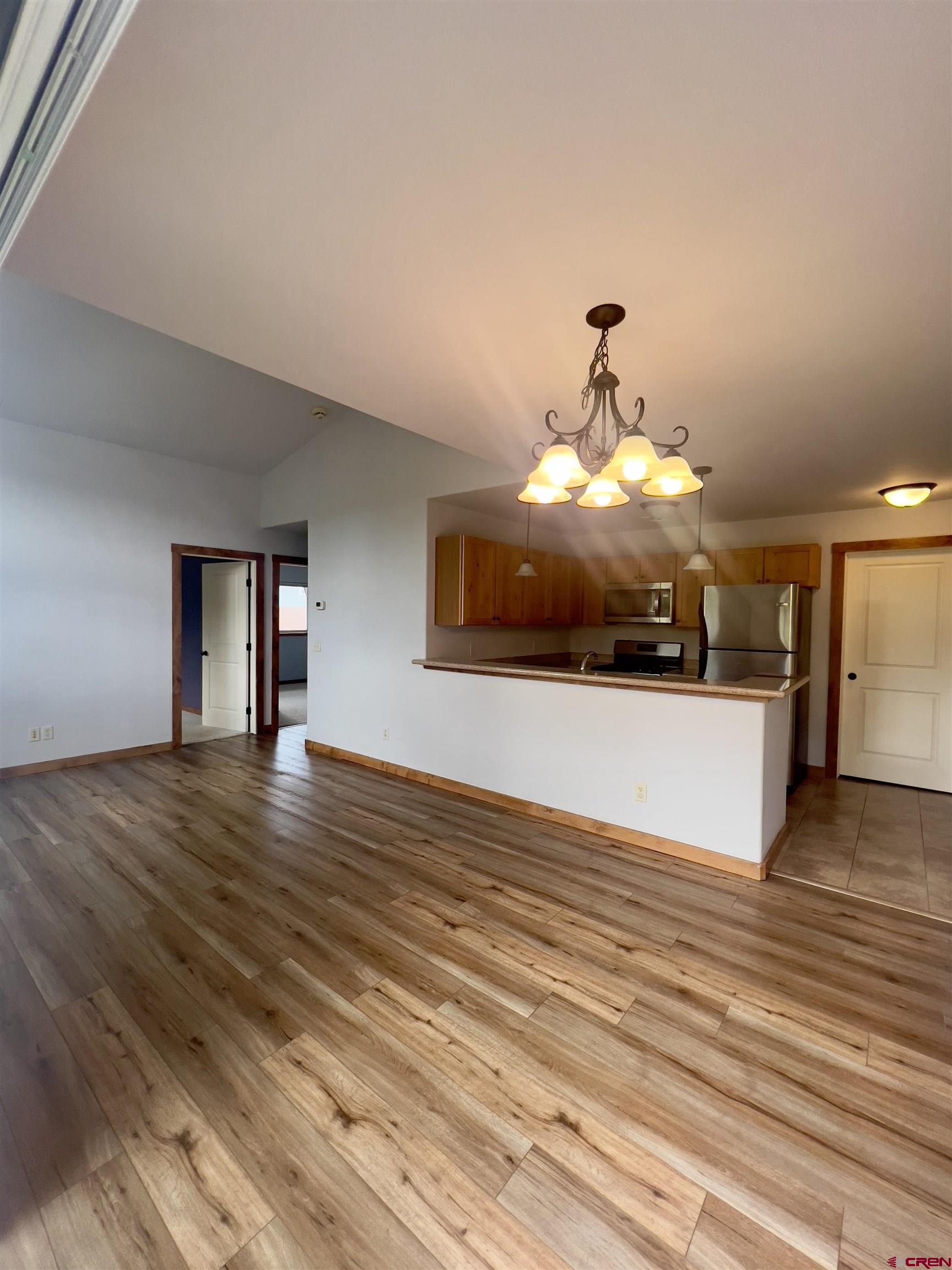 540 Redcliff Circle, Unit E 203 Ridgway, CO 81432 - Photo 14 of 36 a view of a room with kitchen island