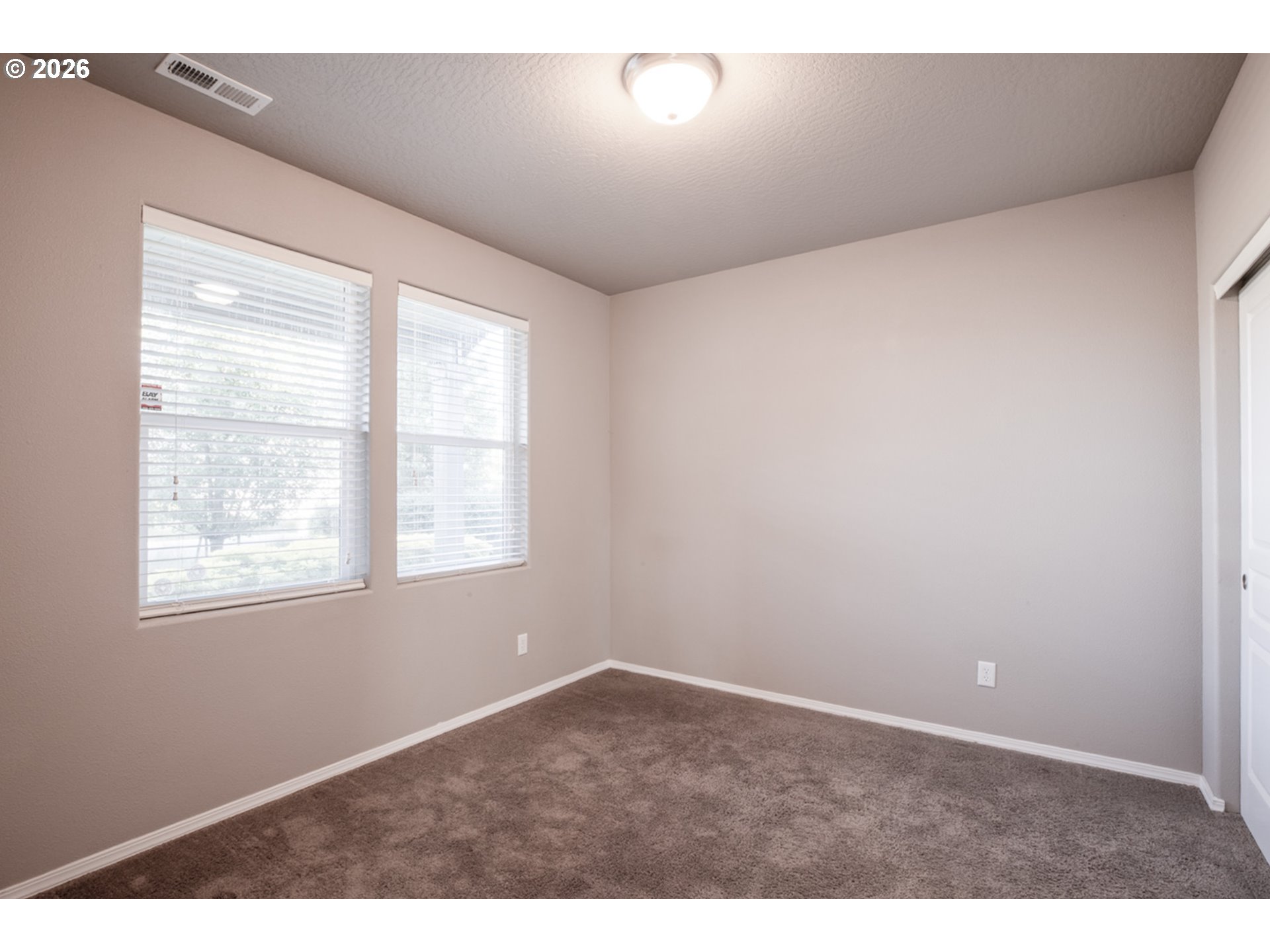 2952 Shelby Way Eugene, OR 97404 - Photo 13 of 25 a view of an empty room with a window