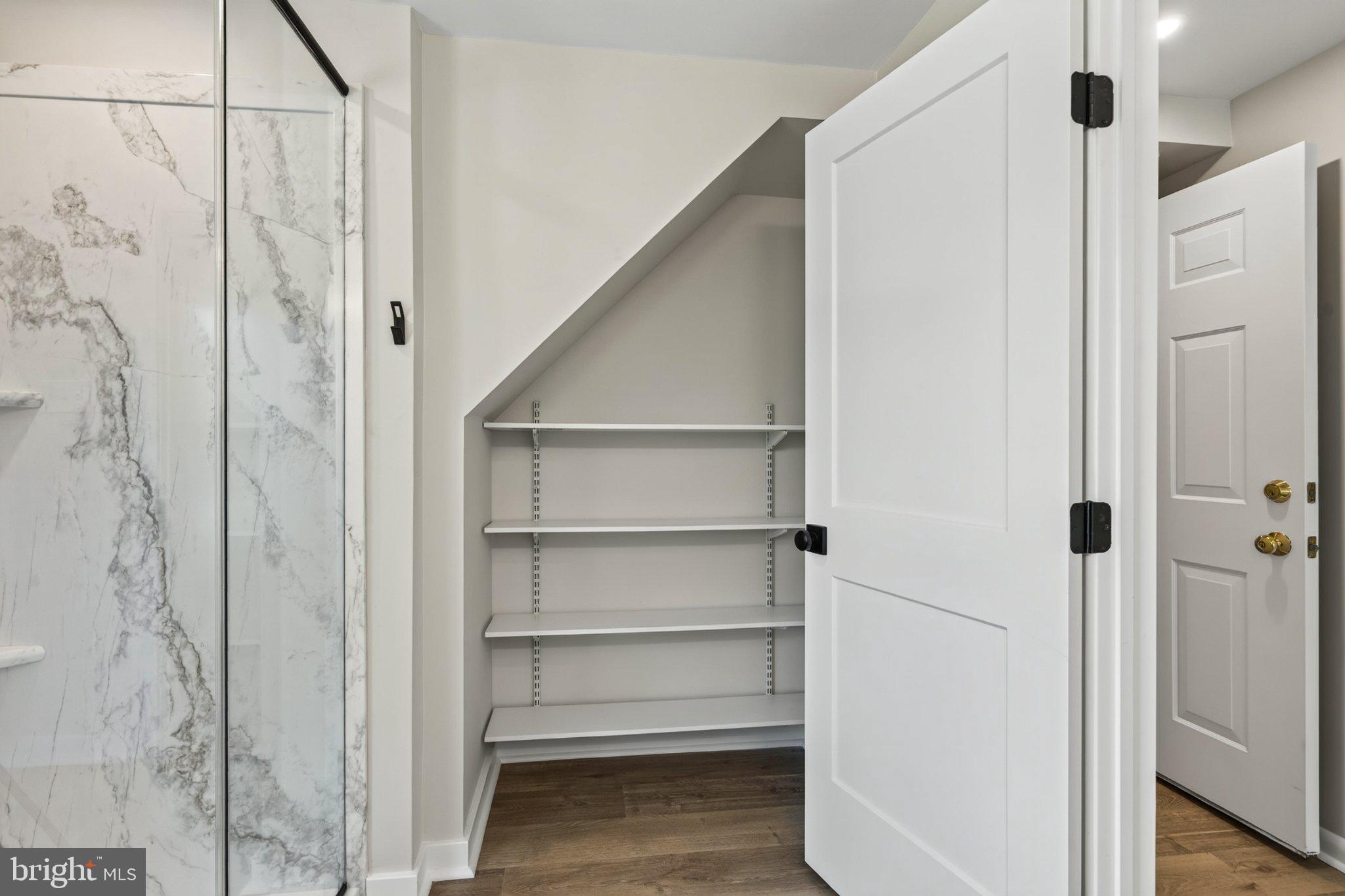 2069 Dutton Mill Road Newtown Square, PA 19073 - Photo 38 of 70 Stylish storage under the stairs.