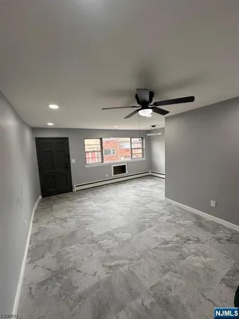 a big room with closet and windows