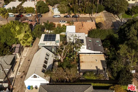 an aerial view of a house with outdoor space