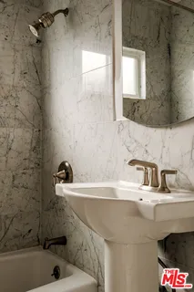a bathroom with a sink and a bathtub