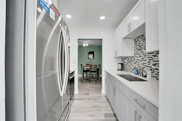 a bathroom with a bathtub and a sink