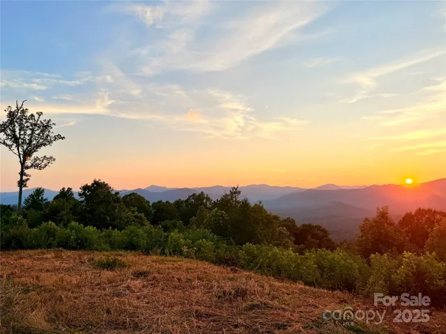 a view of mountain and sunset