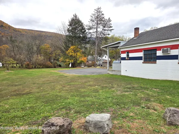 a view of a yard with an outdoor seating