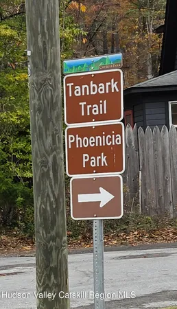 a sign broad on the side of the tree