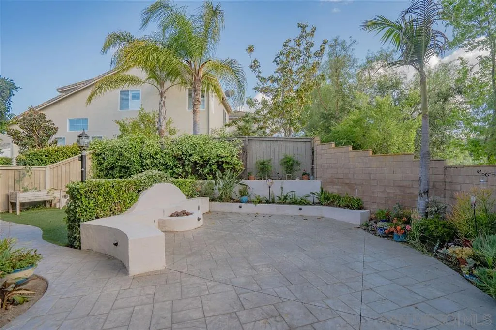 12236 Pepper Tree Lane Poway, CA 92064 - Photo 4 of 6 a view of a chair and table in backyard